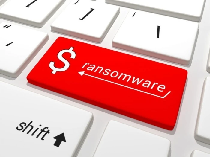 Teclado con tecla roja destacada que dice "$ ransomware", simbolizando la amenaza del ransomware en sistemas informáticos.